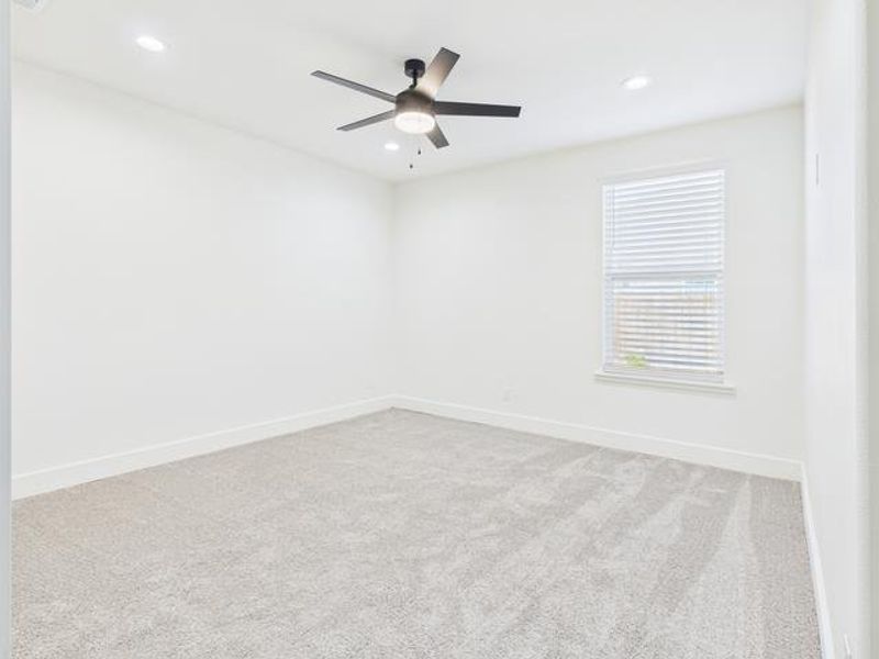 Empty room featuring light carpet, a ceiling fan, and recessed lighting Empty room featuring light carpet, a ceiling fan, and recessed lighting