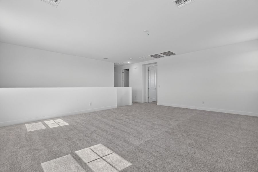 Spacious, unfurnished interior of a new home in The Grove at El Cidro, Goodyear (Image 29).