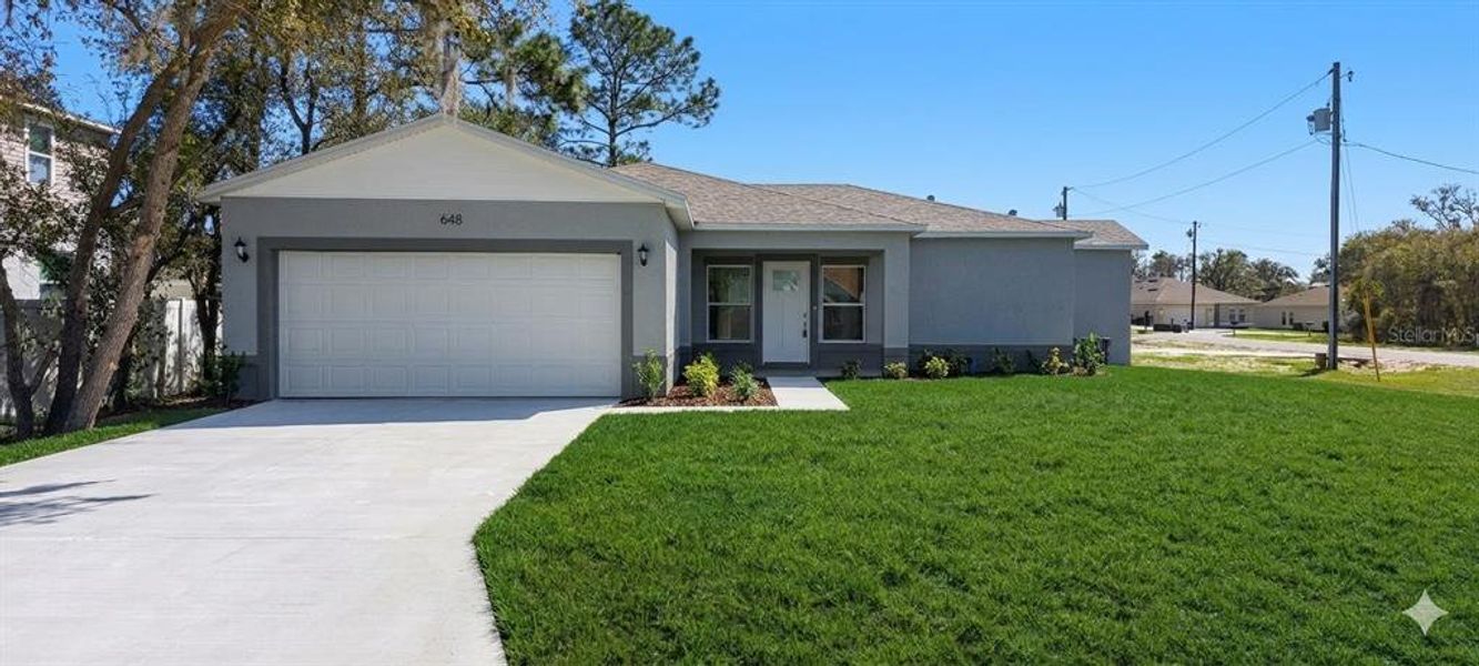 Front exterior of a new home in , Kissimmee, FL, highlighting curb appeal (Image 20). Front exterior of a new home in , Kissimmee, FL, highlighting curb appeal (Image 20).