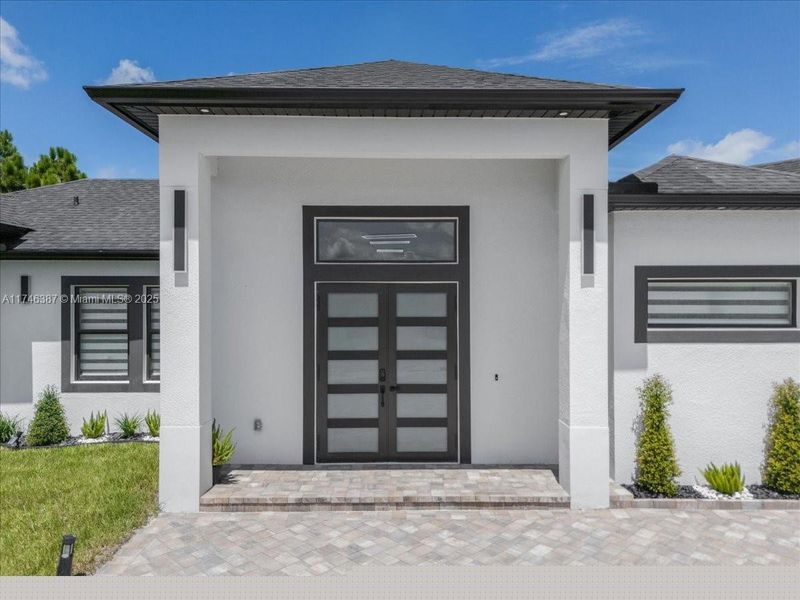Front exterior of a new home in , Lehigh Acres, FL, highlighting curb appeal (Image 21).