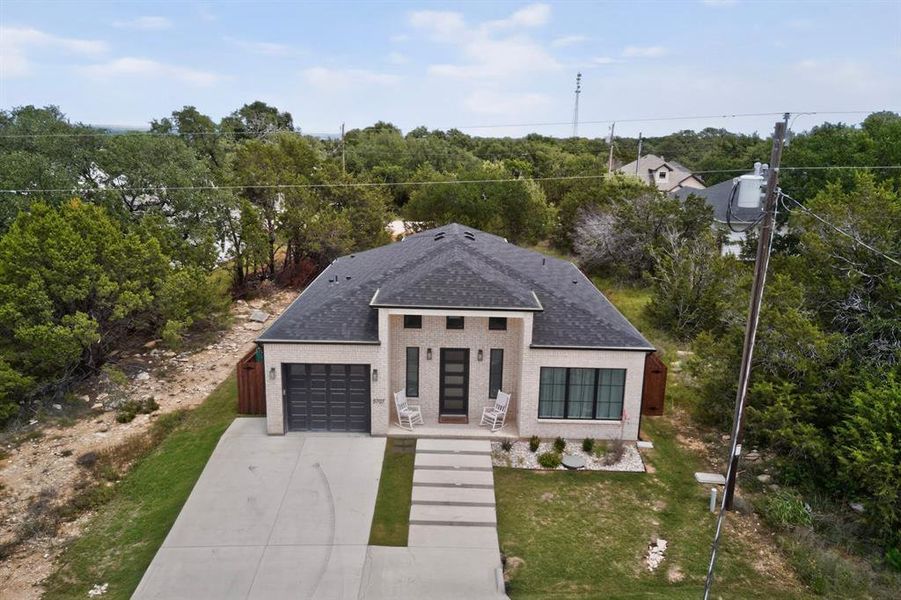 Front exterior of a new home in , Granbury, TX, highlighting curb appeal (Image 22).