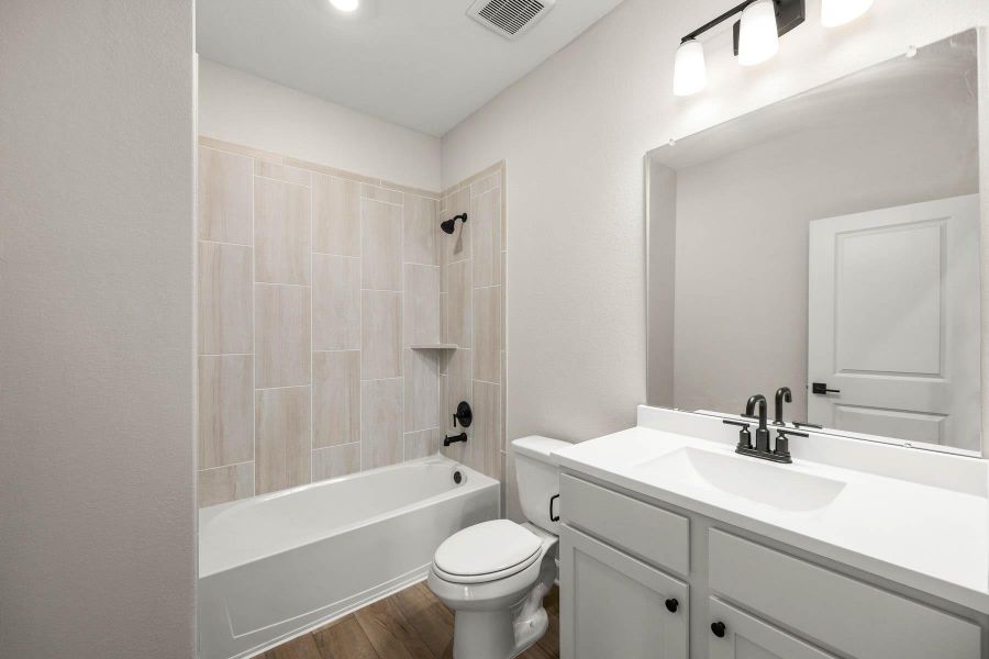 Furnished interior view inside a new home in Sunterra, Katy (Image 5).