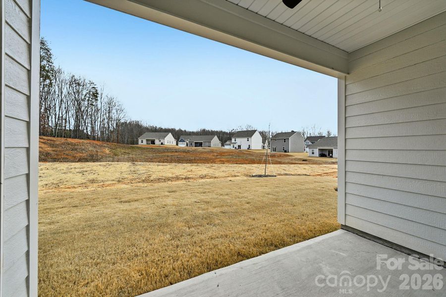 Exterior details and patio area of a home in Colonial Crossing, Troutman (Image 14).
