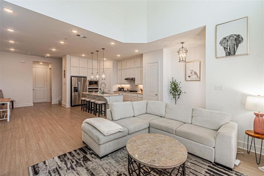 Living room featuring recessed lighting and light wood-style flooring