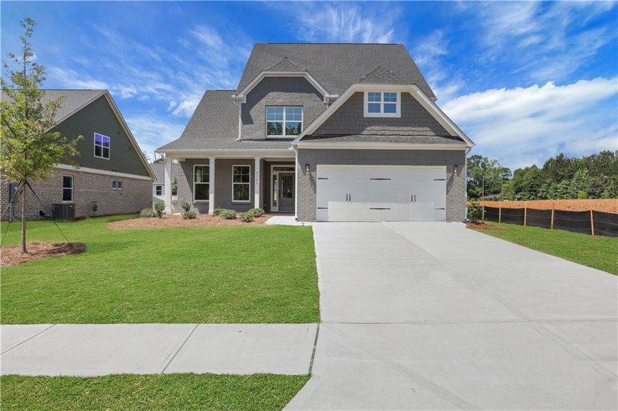 Front exterior of a new home in , Loganville, GA, highlighting curb appeal (Image 2). Front exterior of a new home in , Loganville, GA, highlighting curb appeal (Image 2).