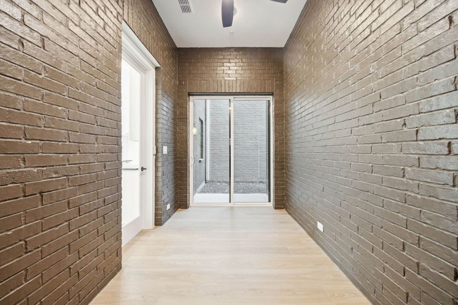 Exterior details and patio area of a home in Newman Village Townhomes, Frisco (Image 20).