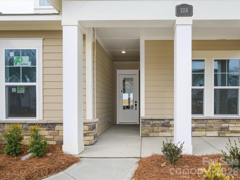 Exterior details and patio area of a home in Encore at Streamside - Tradition Series, Waxhaw (Image 12).