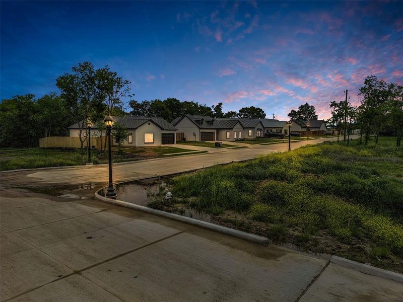 View of front of property featuring a residential view and driveway