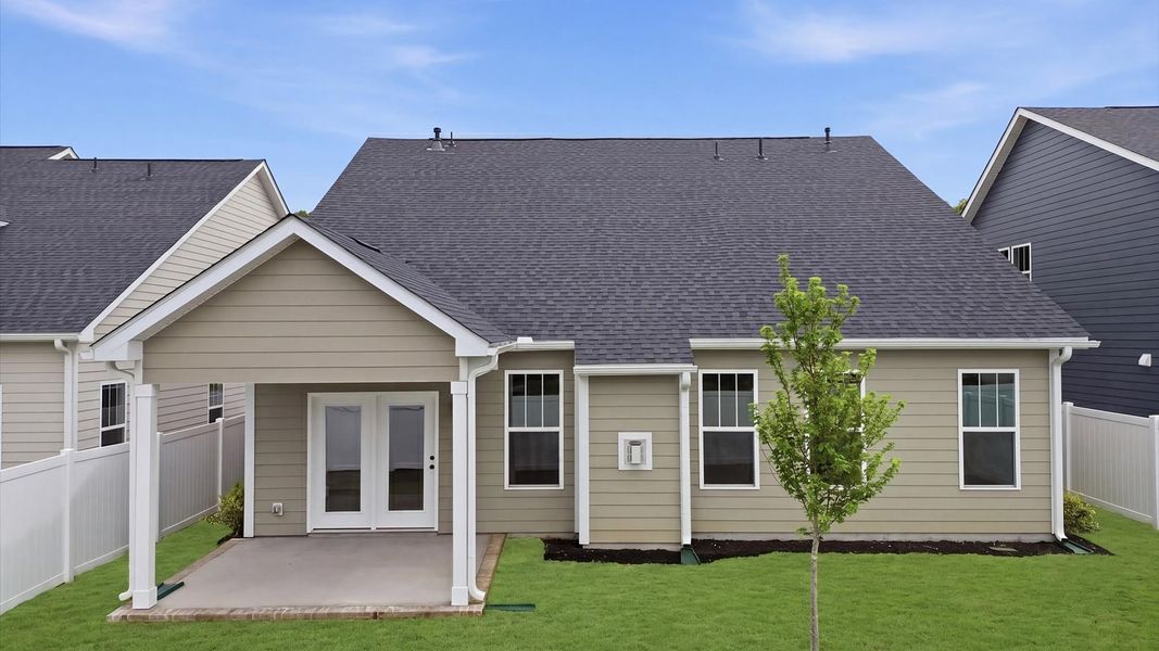 Warm and inviting outdoor living space with a covered rear porch and tasteful finishes located in Greenville, SC
