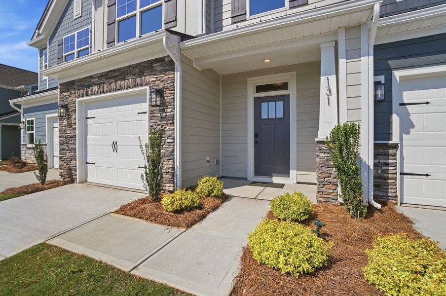 Exterior details and patio area of a home in Blythe Mill Townhomes, Waxhaw (Image 2).