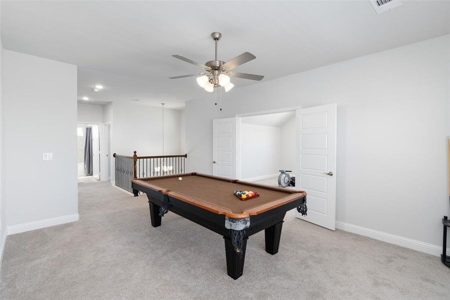 Game room featuring pool table, light carpet, and ceiling fan