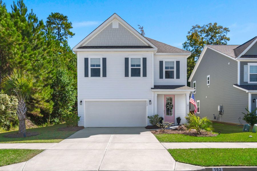 Front exterior of a new home in The Ponds, Summerville, SC, highlighting curb appeal (Image 2). Front exterior of a new home in The Ponds, Summerville, SC, highlighting curb appeal (Image 2).