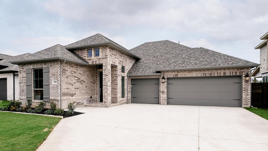 Front exterior of a new home in Juniper Springs, Lockhart, TX, highlighting curb appeal (Image 17).
