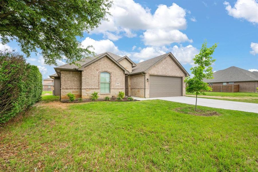 Front exterior of a new home in , Cleburne, TX, highlighting curb appeal (Image 20).