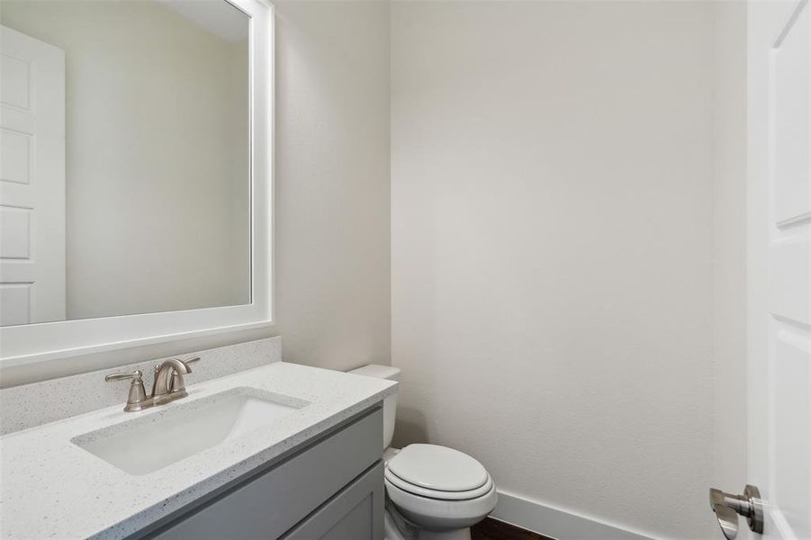 Bathroom with vanity and toilet