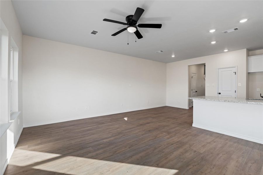 This open living space feels airy and inviting, creating a natural gathering area that connects the home’s main living areas.