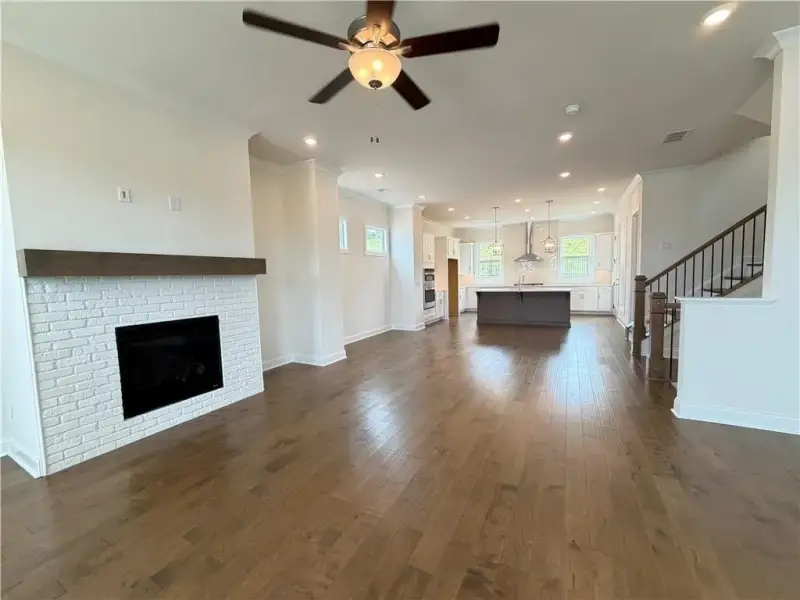 Fireplace illuminates the living room with prewired smart tubes for no show TV Wiring *Images shown are from a different homesite featuring the Aspen Floor Plan. Design selections and colors will vary by home. *