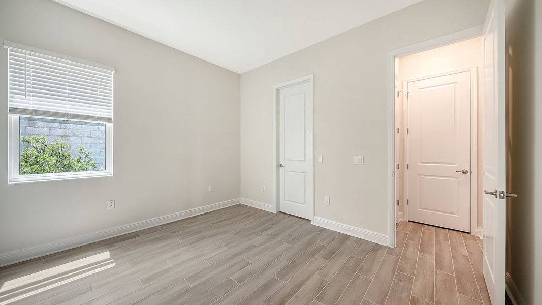 Spacious, unfurnished interior of a new home in Canoe Creek Real Estate and Homes for Sale in Parrish, FL - Neal Communities, Parrish (Image 57).