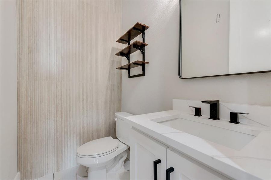 Bathroom with toilet and vanity