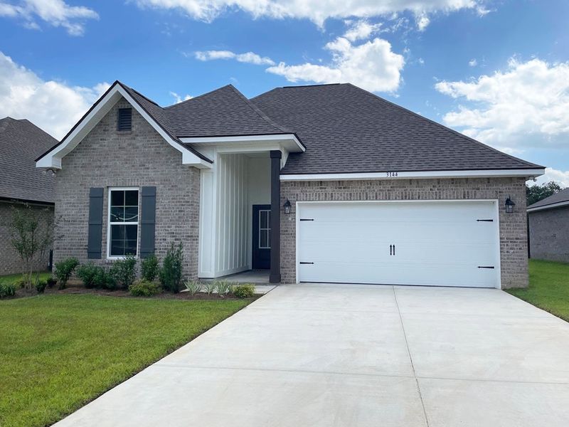 Front exterior of a new home in Eagle Pointe, Pensacola, FL, highlighting curb appeal (Image 1). Front exterior of a new home in Eagle Pointe, Pensacola, FL, highlighting curb appeal (Image 1).