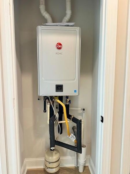 Utilities featuring tankless water heater