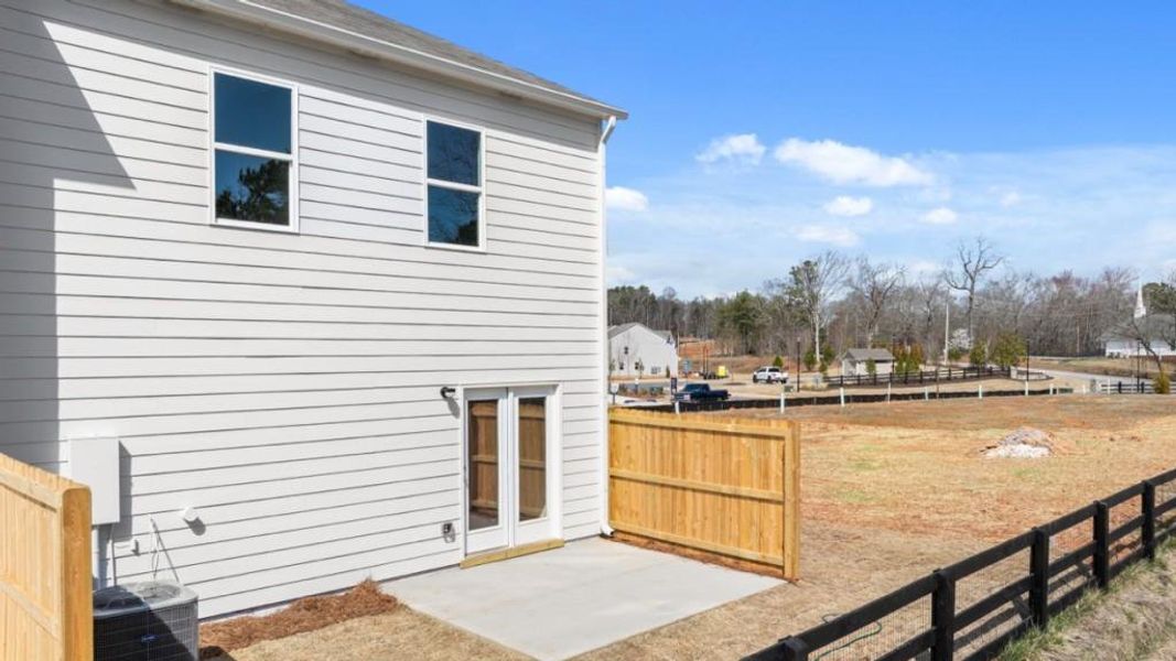 Exterior details and patio area of a home in Falcon Landing Townhomes, Gainesville (Image 3).