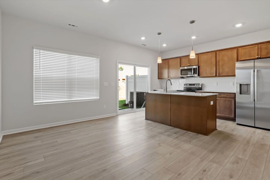 Furnished interior view inside a new home in West Main Townhomes, Sanford (Image 6).