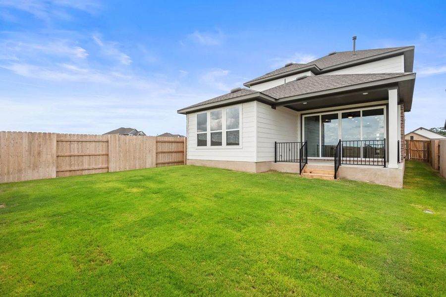 Exterior details and patio area of a home in Lariat, Liberty Hill (Image 3).