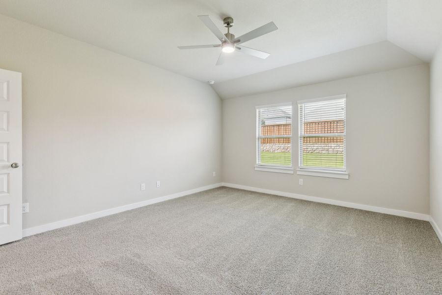 Primary Suite in the Heisman home plan by Trophy Signature Homes – REPRESENTATIVE PHOTO