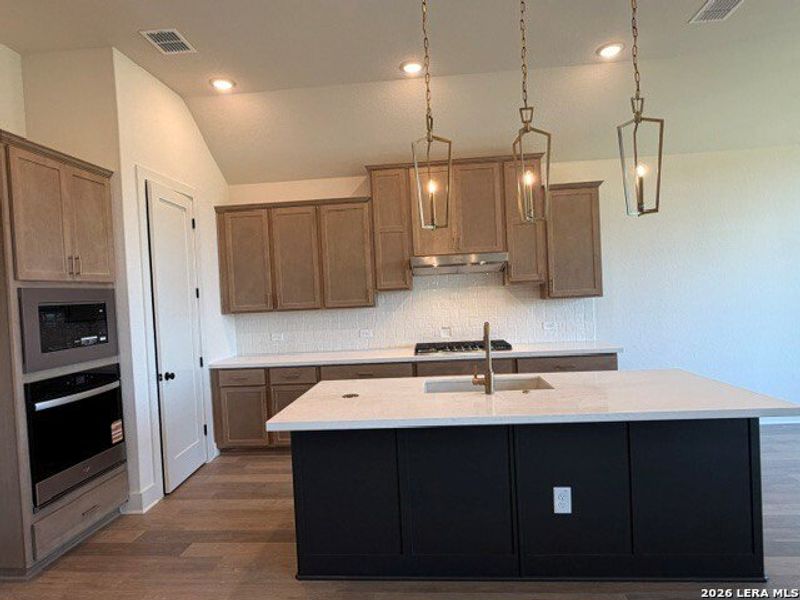 Furnished interior view inside a new home in Ladera - 50s, San Antonio (Image 6).