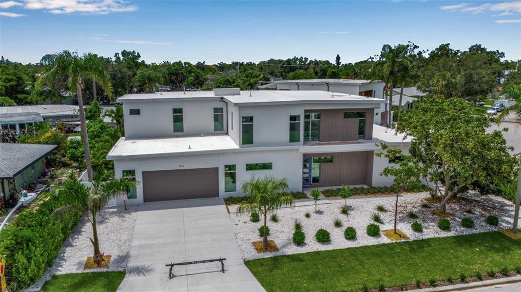 Front exterior of a new home in , Sarasota, FL, highlighting curb appeal (Image 21).