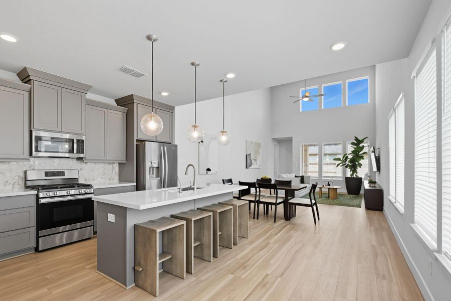 One of the standout features is the open floor plan, seamlessly connecting the family room, dining, and kitchen - ideal for hosting family & friends! While each space is clearly delineated, the wood look vinyl plank floor ensures a sense of cohesion between the spaces.