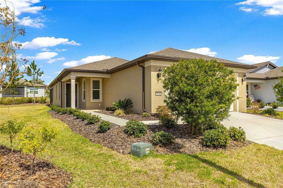Front exterior of a new home in Del Webb Stone Creek, Ocala, FL, highlighting curb appeal (Image 23).