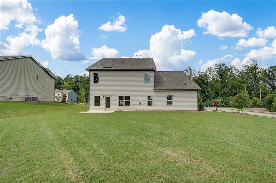 Front exterior of a new home in Traditions at Crystal Lake, Hampton, GA, highlighting curb appeal (Image 16). Front exterior of a new home in Traditions at Crystal Lake, Hampton, GA, highlighting curb appeal (Image 16).