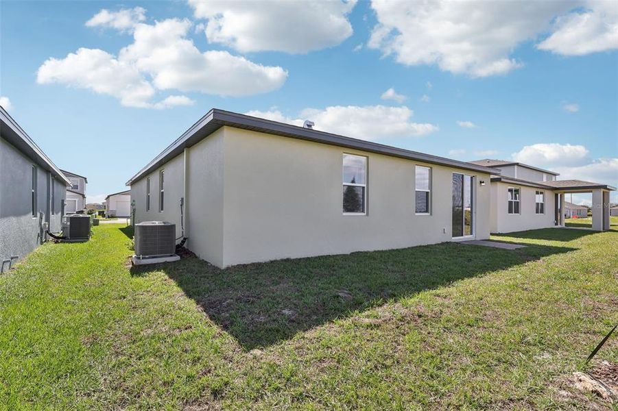 Exterior details and patio area of a home in Lake Deer Estates - Signature Series, Poinciana (Image 25).