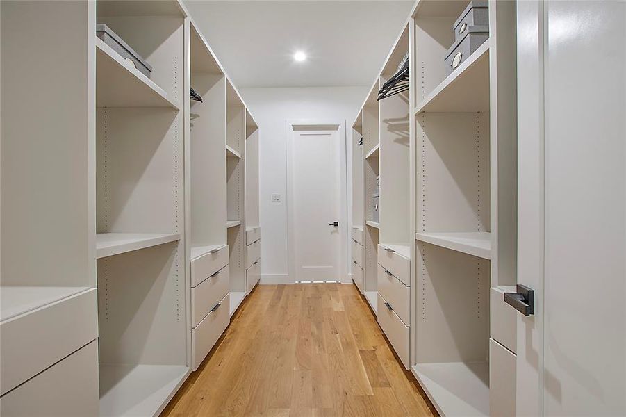 Walk in closet featuring light wood-type flooring