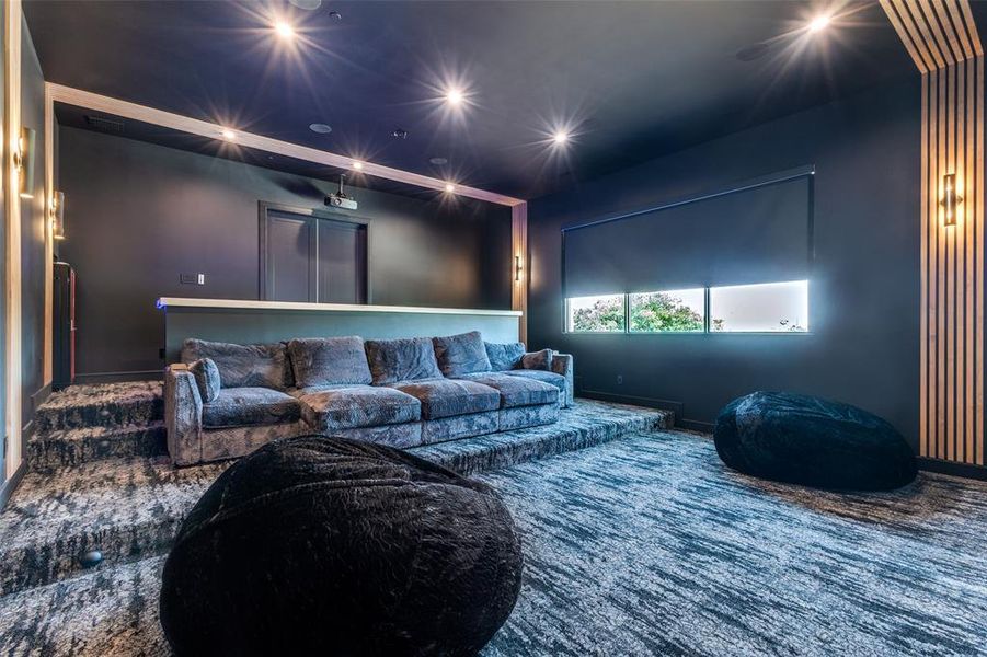 Home theater room featuring carpet flooring