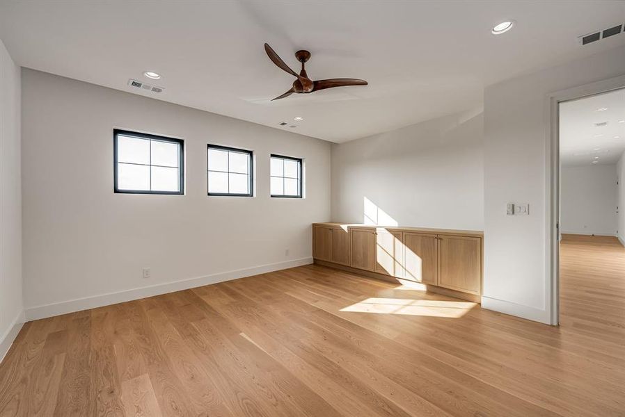 Empty room with light wood-style flooring, recessed lighting, and ceiling fan