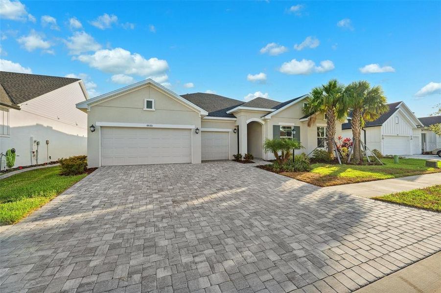 Front exterior of a new home in Copeland Creek, Odessa, FL, highlighting curb appeal (Image 27). Front exterior of a new home in Copeland Creek, Odessa, FL, highlighting curb appeal (Image 27).