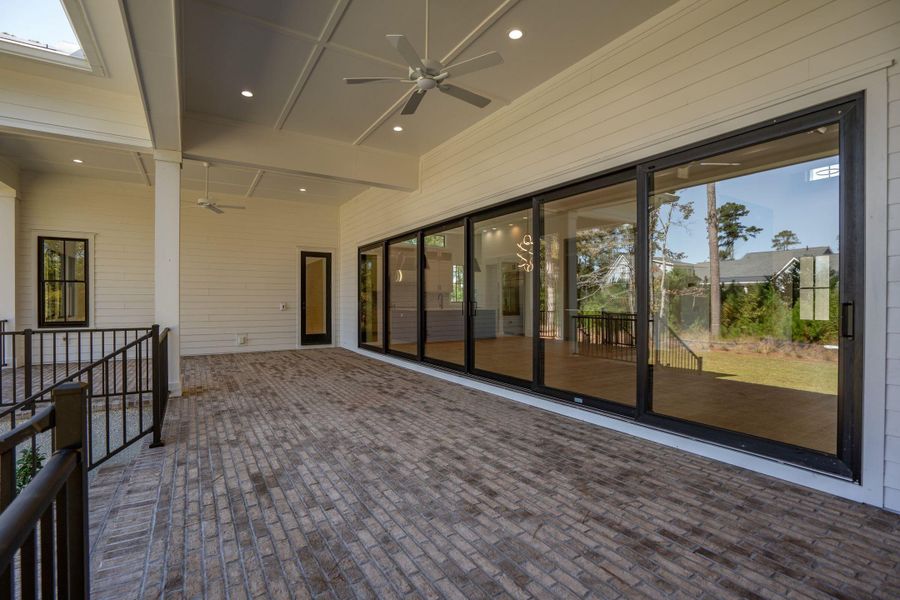 Exterior details and patio area of a home in , Ravenel (Image 35).