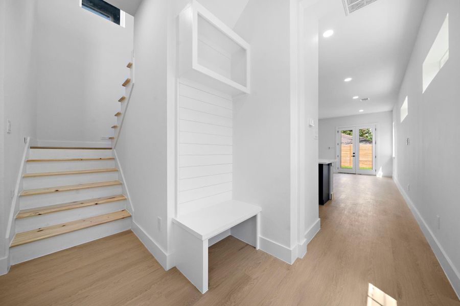 Entry with storage and bench. Entry with storage and bench.