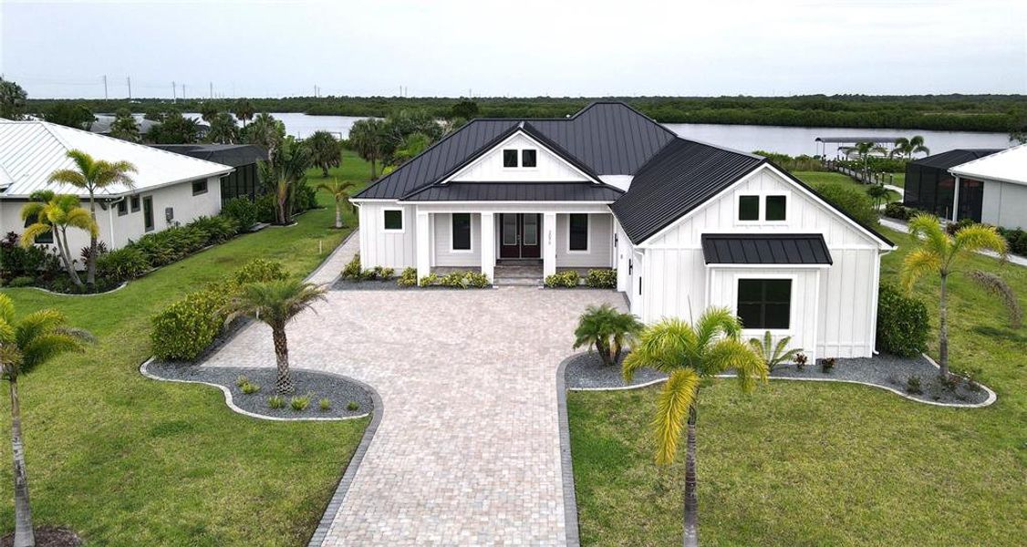 Front exterior of a new home in , Punta Gorda, FL, highlighting curb appeal (Image 25).