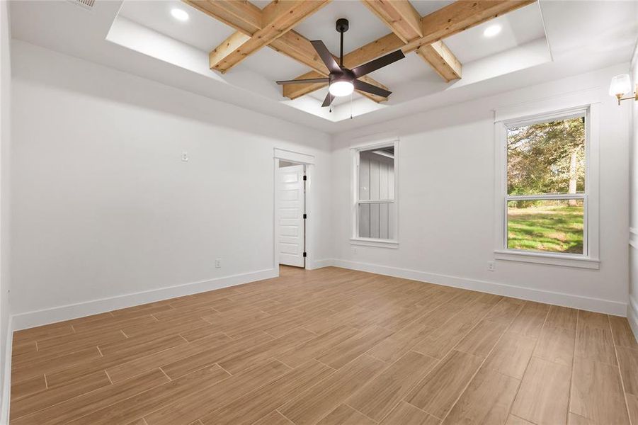 Owner room featuring coffered ceiling, beam ceiling, wood finish floors, a ceiling fan, and recessed lighting