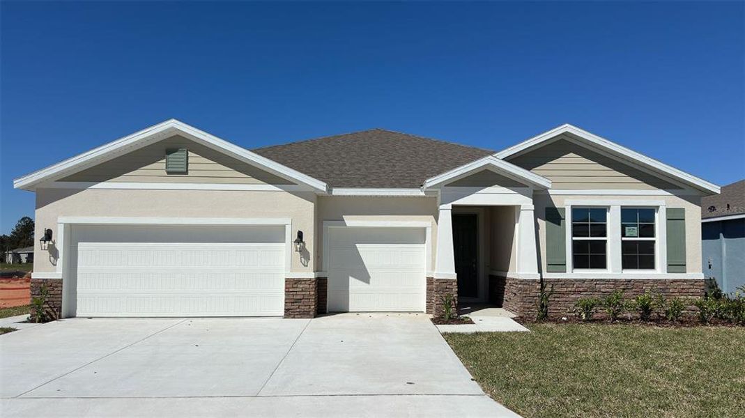 Front exterior of a new home in Archers Mill, Ormond Beach, FL, highlighting curb appeal (Image 1). Front exterior of a new home in Archers Mill, Ormond Beach, FL, highlighting curb appeal (Image 1).