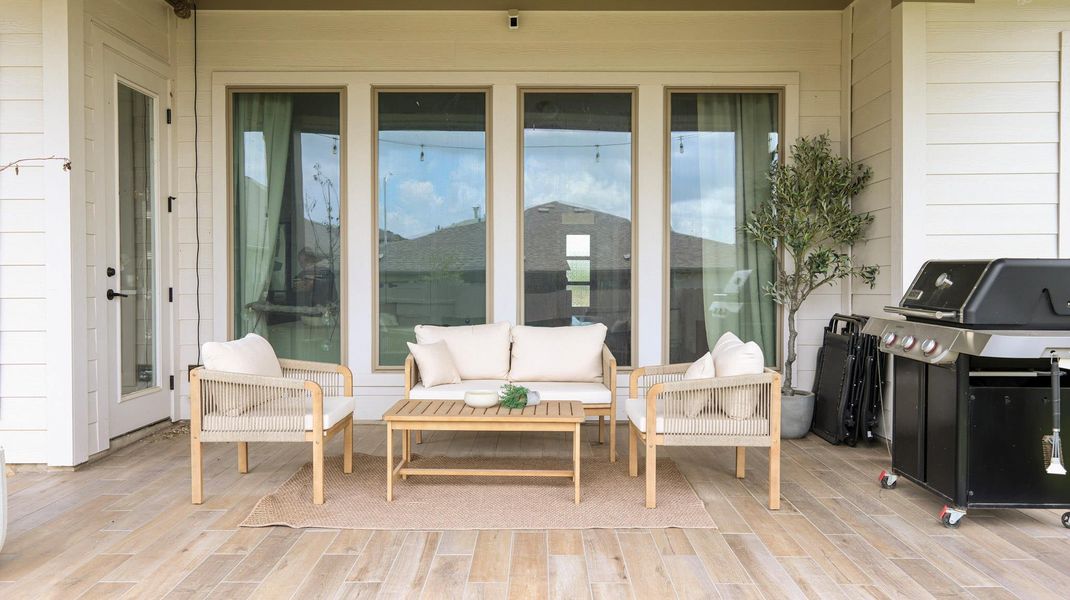 An inviting outdoor living space with durable tile flooring awaits your leisure. An inviting outdoor living space with durable tile flooring awaits your leisure.