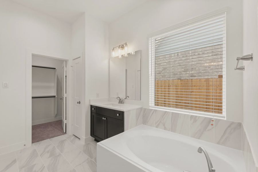 Representative furnished interior of a home built from the St Andrews by Chesmar Homes in Riceland Alley Loads, Mont Belvieu (Image 14).