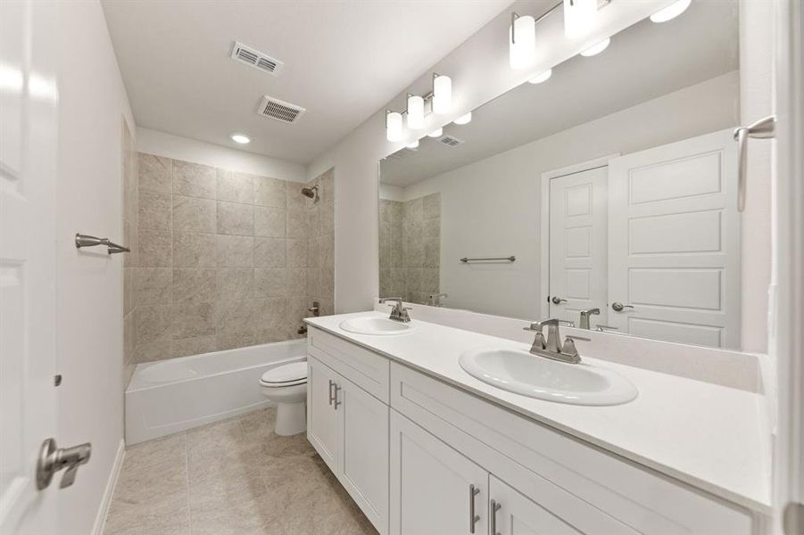 Guest will enjoy their own vanity space in this thoughtfully designed guest bath.