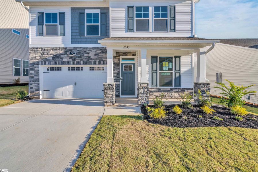 Front exterior of a new home in Halton Oaks, Spartanburg, SC, highlighting curb appeal (Image 17).