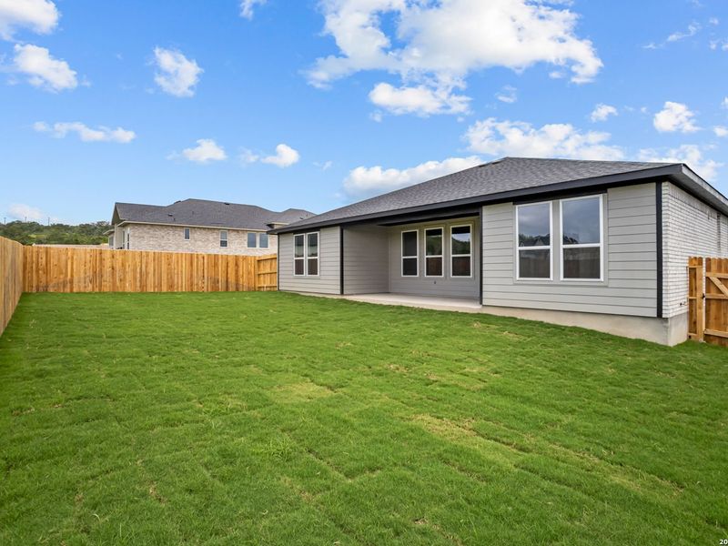 Exterior details and patio area of a home in The Reserve at Potranco Oaks, Castroville (Image 23).