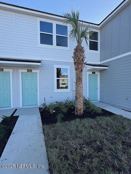 Exterior details and patio area of a home in Cordera Townhomes, St. Augustine (Image 19).